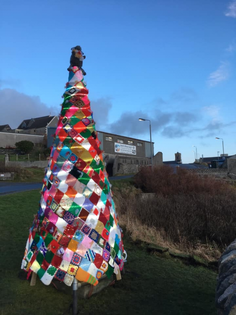 Christmas tree made from quilted squares, Barra community centre in the background