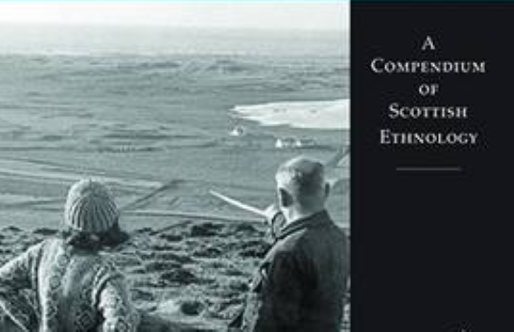 Book cover showing 2 people on a hill looking out over a landscape with a loch in the distance